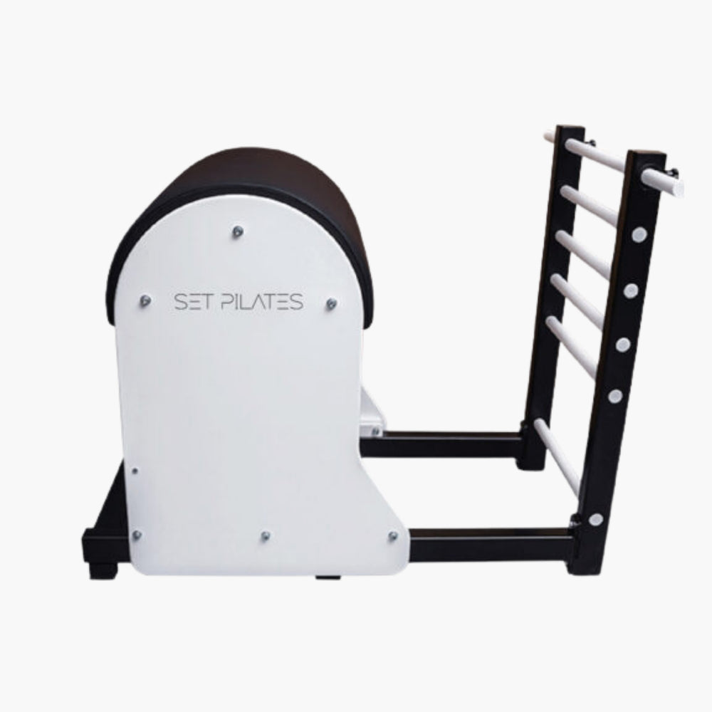 Set Pilates SBL Ladder Barrel with a white front plate and black frame, featuring a curved foam roller and a ladder-style support frame with white bars.
