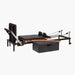 Set Pilates Home Metal Reformer with black padded mat and straps, wooden rails, metal frame components, and a black storage box on a light gray background.
