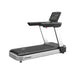 Origin Fitness Impulse AC4000 Commercial LED Treadmill with a black running belt, black handrails, and a silver frame, featuring an integrated digital display screen on the console, shown against a plain white background.