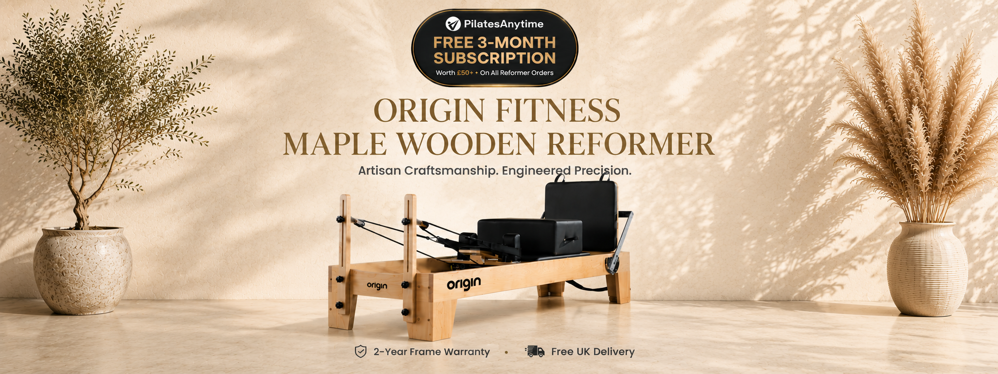 A wooden reformer exercise machine with black padding, shown in a styled indoor setting with potted plants and warm sunlight shadows on a beige wall. Promotional text at the top reads 'Origin Fitness Maple Wooden Reformer' and includes a subscription offer.