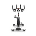 Origin Fitness Impulse PS450 Commercial Indoor Cycle with a black and silver frame, black handlebars, and black pedals, photographed from a front-facing perspective on a clean white background.