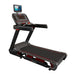 A black and gray treadmill with red accents, featuring a digital console screen and handrails, shown on a plain white background.