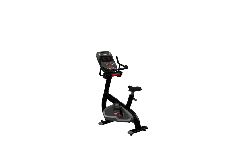 A stationary exercise bike with a digital console display, black frame, and gray seat and pedals, isolated on a solid white background.