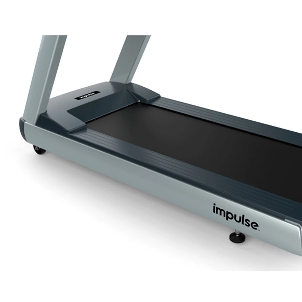 Origin Fitness Impulse RT700 Commercial LED Treadmill - Black shown from a high-angle side view, featuring a dark gray frame, black running belt, and silver accents on a white background.