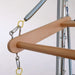 Close-up of a wooden hanger bar suspended from a metal frame with springs and clips against a plain light background.