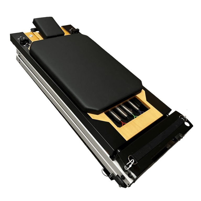 Black and yellow Atro Pilates Portable Folding Reformer