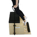 A Pilates reformer machine with a wooden base, black padded platform, handlebar, and foot roller, shown with a person's legs and feet stepping onto the exercise surface against a white background.